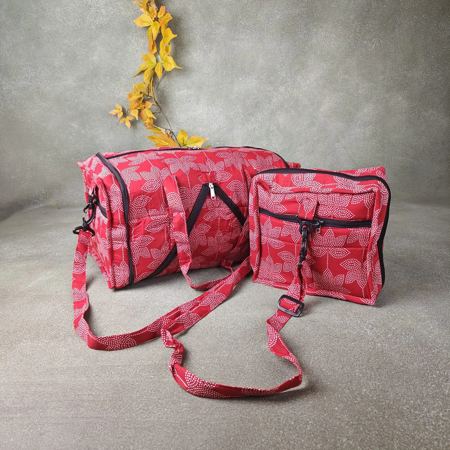 Expandable Travel Bag Light Red Colour with White Big Leaf Printed Design.